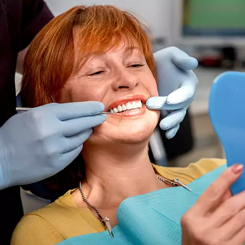 Woman Admiring Her New Dental Implants